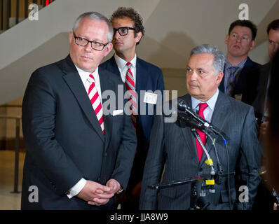 Washington, Us. 14th July, 2017. Michael R. Caputo, left, a Republican political strategist and media consultant, and his attorney, former New York state Attorney General Dennis Vacco, right, listen to questions as they meet the press following Caputo's testimony before the United States House Permanent Select Committee on Intelligence as part of their investigation into Russian interference in Washington, DC on Friday, July 14, 2017. Credit: Ron Sachs/CNP - NO WIRE SERVICE - Photo: Ron Sachs/Consolidated News Photos/Ron Sachs - CNP/dpa/Alamy Live News Stock Photo