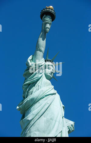 Statue of Liberty low angle view, blue sky in New York Stock Photo