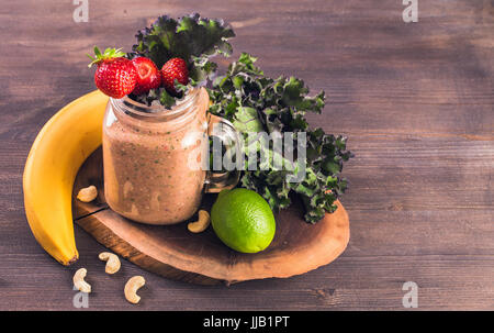 Jar of smoothie with strawberry and kale Stock Photo