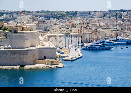 Fort Saint Angelo, a large bastioned fort in Birgu, Malta, located at the centre of the Grand Harbour, as seen from Upper Barracca Gardens, with marin Stock Photo