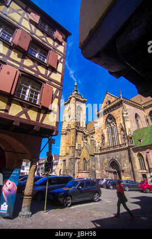 Picturesque street scenes with St Martin's Church in the background from Colmar Alsace France Stock Photo