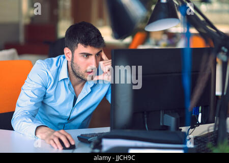 Freelance programmer working in startup office Stock Photo