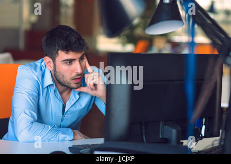 Freelance programmer working in startup office Stock Photo