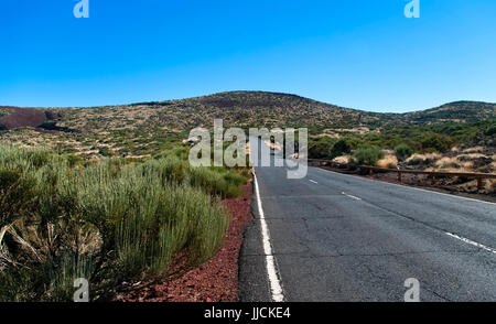 road through volcanic desert in El Teide National Park on Tenerife island Stock Photo