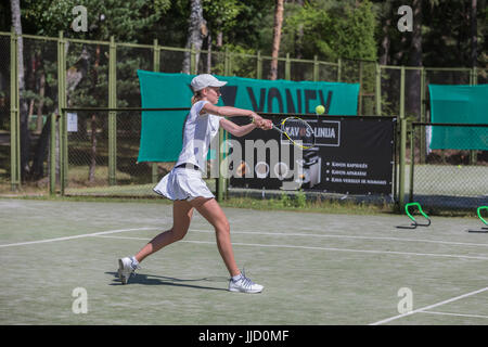 Female tennis player hitting ball on the tennis court, Palanga, Lithuania. Stock Photo