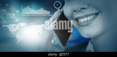 Close up of smiling businesswoman talking on mobile phone against light circles on black background Stock Photo