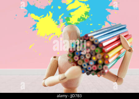 Colourful paint splashes against gray flooring and wall Stock Photo