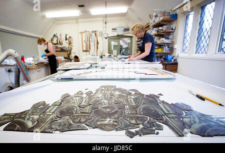 York Glaziers, Britain's oldest and largest specialist stained glass conservation studio who celebrate their 50th anniversary tomorrow, restoring the final panels or York Minster's Great East Window, the largest medieval stained glass window in England. Stock Photo