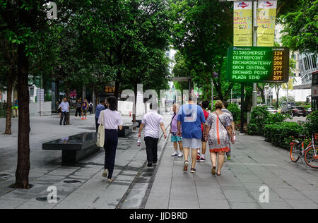 Singapore - Jun 14, 2017. People walking on Orchard Road in Singapore. Orchard Road is the retail and entertainment hub of Singapore. Stock Photo