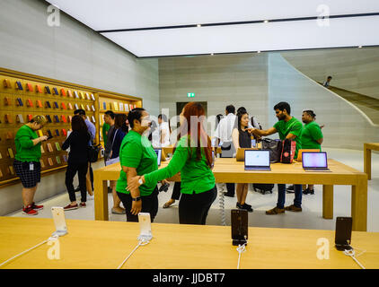 Singapore - Jun 14, 2017. People visit the Apple Store in Orchard Rd, Singapore. Tourism forms a large part of the Singapore economy, with over 15 mil Stock Photo