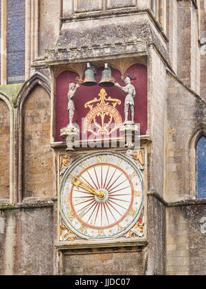 The exterior dial, on the north transept, of the medieval astronomical clock of Wells Cathedral, Wells, Somerset, England, UK. The quarter-jacks, in t Stock Photo