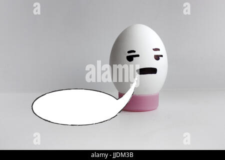 White cloud of thought is empty. Place under the text. Egg cheerful with face alone on white background concept of gossip. Photo for your design Stock Photo