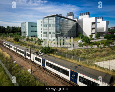 Biomedical Cambridge - MRC Molecular Biology Lab / Train - A London to Cambridge Train  passes the MRC Laboratory of Molecular Biology, Cambridge UK. Stock Photo