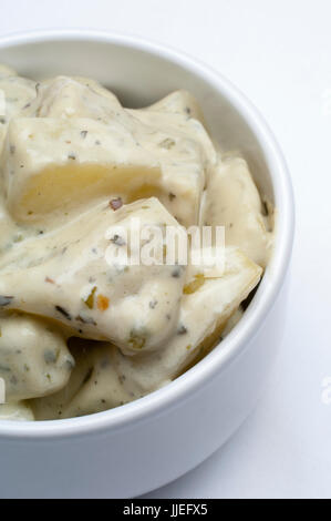 Homemade Potato Salad in a white bowl Stock Photo