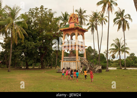 Kids playing and running in their village in Laos Stock Photo