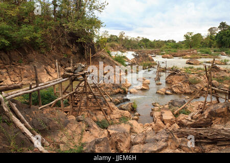 people fishing with a rudimentary network in the Mekong river at Don Khon island on Laos Stock Photo