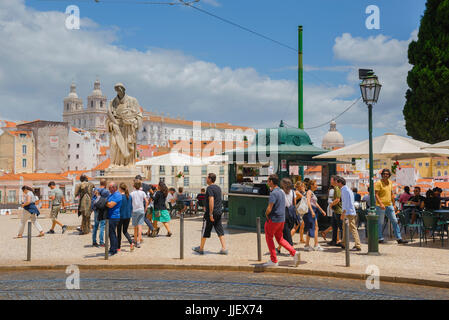Lisbon Portas do Sol, tourists stroll through the Portas do Sol, an elevated terrace offering panoramic views of the Alfama quarter, Lisbon, Portugal Stock Photo