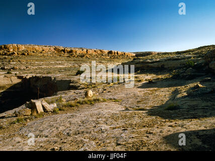 View NNW of part of the Chacoan road system across a cleared section of slickrock on Alto Mesa above Chetro Ketl Pueblo, Chaco Canyon, New Mexico. Stock Photo