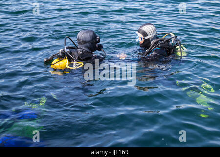A scuba diver getting last instructions before the dive Stock Photo