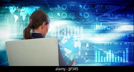 Rear view of businesswoman using mobile while sitting on chair against curved laser light design in purple Stock Photo