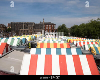 The colourful striped roofs of the market stall in the covered market in Norwich Norfolk UK Stock Photo