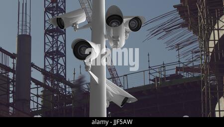 Digital composite of CCTV stick in front of a construction Stock Photo