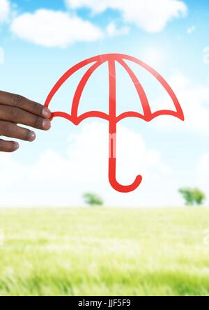 Digital composite of Cut out umbrella protection in landscape Stock Photo