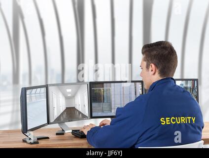Digital composite of security guard looking the images of the security cameras on the screens, in the office Stock Photo
