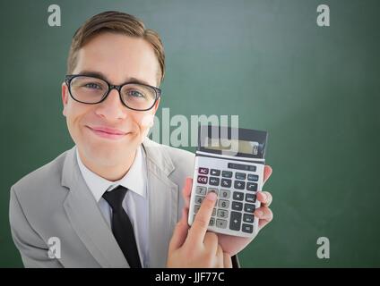 Digital composite of Man looking up with calculator against green chalkboard Stock Photo