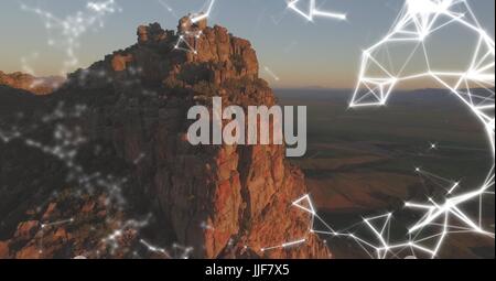 Digital composite of White network against cliff with design sign Stock Photo