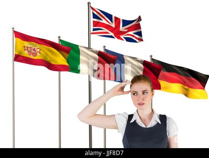Digital composite of main language flags behind young businesswoman thinking Stock Photo