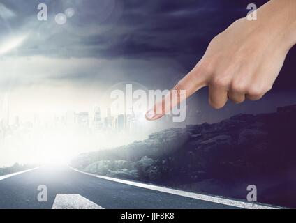 Digital composite of Hand touching sky with atmospheric road Stock Photo