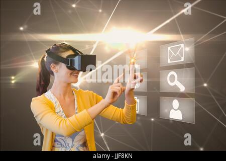 Digital composite of model with VR set Stock Photo