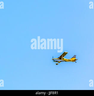 small single engine place flying over Gibson Beach in Sagaponack ny Stock Photo