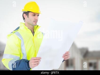 Digital composite of Architect with blueprints on building site Stock Photo