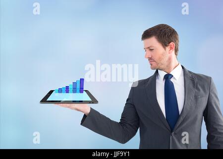 Digital composite of model with device with graph Stock Photo