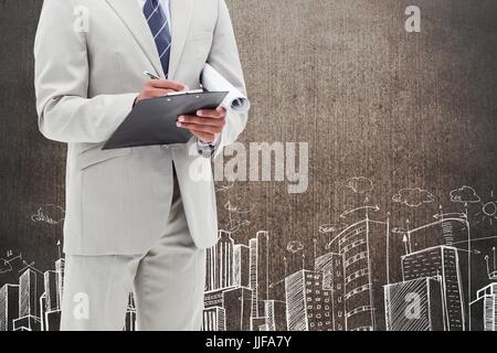 Digital composite of business man against grunge wall with city drawing Stock Photo