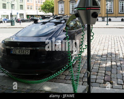 Electric car charging up on road side in Trondheim Norway
