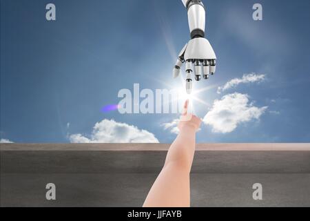 Digital composite of human and robot hand Stock Photo