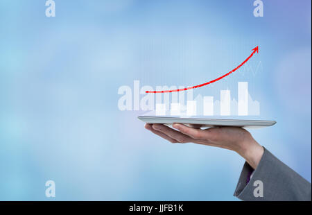 Digital composite of model  holding  tablet with graphs Stock Photo