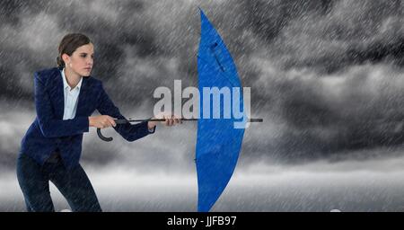 Digital composite of Business woman with umbrella and blocking rain against storm clouds Stock Photo