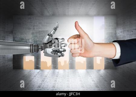 Digital composite of human and robot hand Stock Photo
