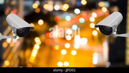 Digital composite of CCTV cameras against illuminated road Stock Photo