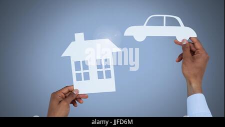Digital composite of Cut out house and car in hands Stock Photo