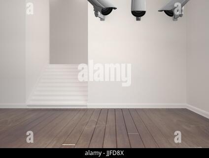 Digital composite of 3 CCTV in the wall in an empty room Stock Photo