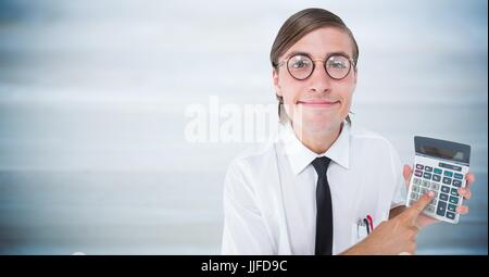 Digital composite of Man looking up with calculator against blurry blue wood panel Stock Photo