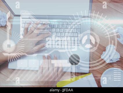 Digital composite of Hands of woman working on a laptop with digital graphics Stock Photo