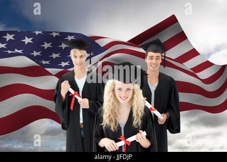 Digital composite of Graduate students against American flag Stock Photo