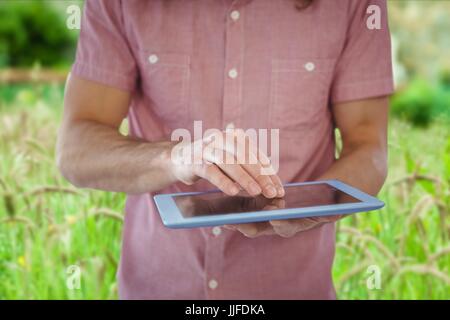 Digital composite of Model with devices farming Stock Photo