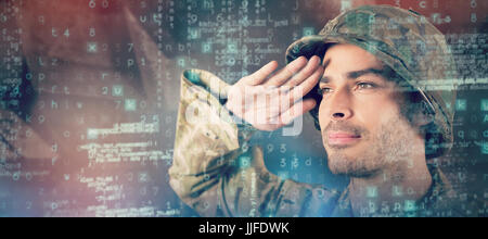 Close up of confident soldier saluting against dark background Stock ...